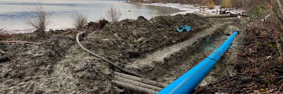 Fusible PVC pipe installation on the bank of a lake